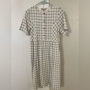 Such an adorable, checkered stitched mid-calf length boutique dress.